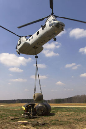 010405-M-1586C-004  CAMP LEJEUNE, N.C. -- Marines from HMM-365 (Rein.) deliver a 500-gallon water bladder to MSSG-26 so the unit can set up an expeditionary resupply station to support BLT 3/6. Photo by: Cpl. Thomas Michael Corcoran