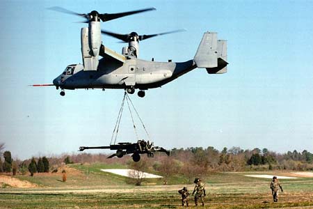 V-22 Osprey lifts 155-millimeter Howitzer during external load testing (Neg#: 990503n2)