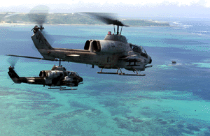 Two AH-1W Super Cobra helicopters from Marine Medium Light Attack Helicopter Squadron-367 make history as they proceed along the coastline of Okinawa, Japan, to complete 40,000 mishap-free flight hours Sept. 1.  
'Scarface,' as the unit is called, is based at Camp Pendelton, Calif., and is on Okinawa for a six-month deployment as part of the Unit Deployment Program.  The program allows units based in the United States to rotate through Okinawa to further their training here and with other nations in the region. Photo by: Staff Sgt. Jason M. Webb